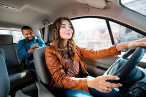 Uber and Lyft driver transporting passengers with rideshare insurance coverage