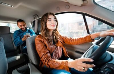 Uber and Lyft driver transporting passengers with rideshare insurance coverage